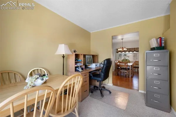 a bedroom with a bed and a table in it