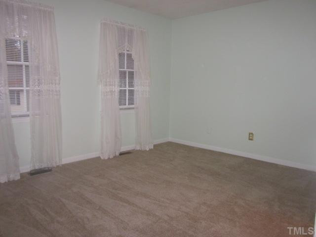 701 Charleston Road Raleigh, NC 27606 - Photo 21 of 25 This is the other master bedroom! Features include a walk in closet and new paint! Bedroom