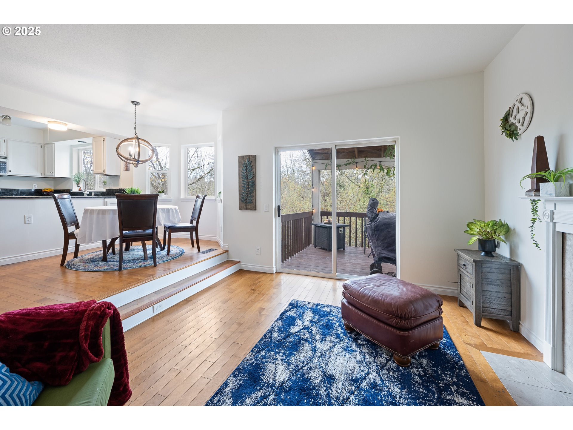 16033 Northwest Ridgetop Lane Beaverton, OR 97006 - Photo 11 of 42 a living room with furniture and a chandelier