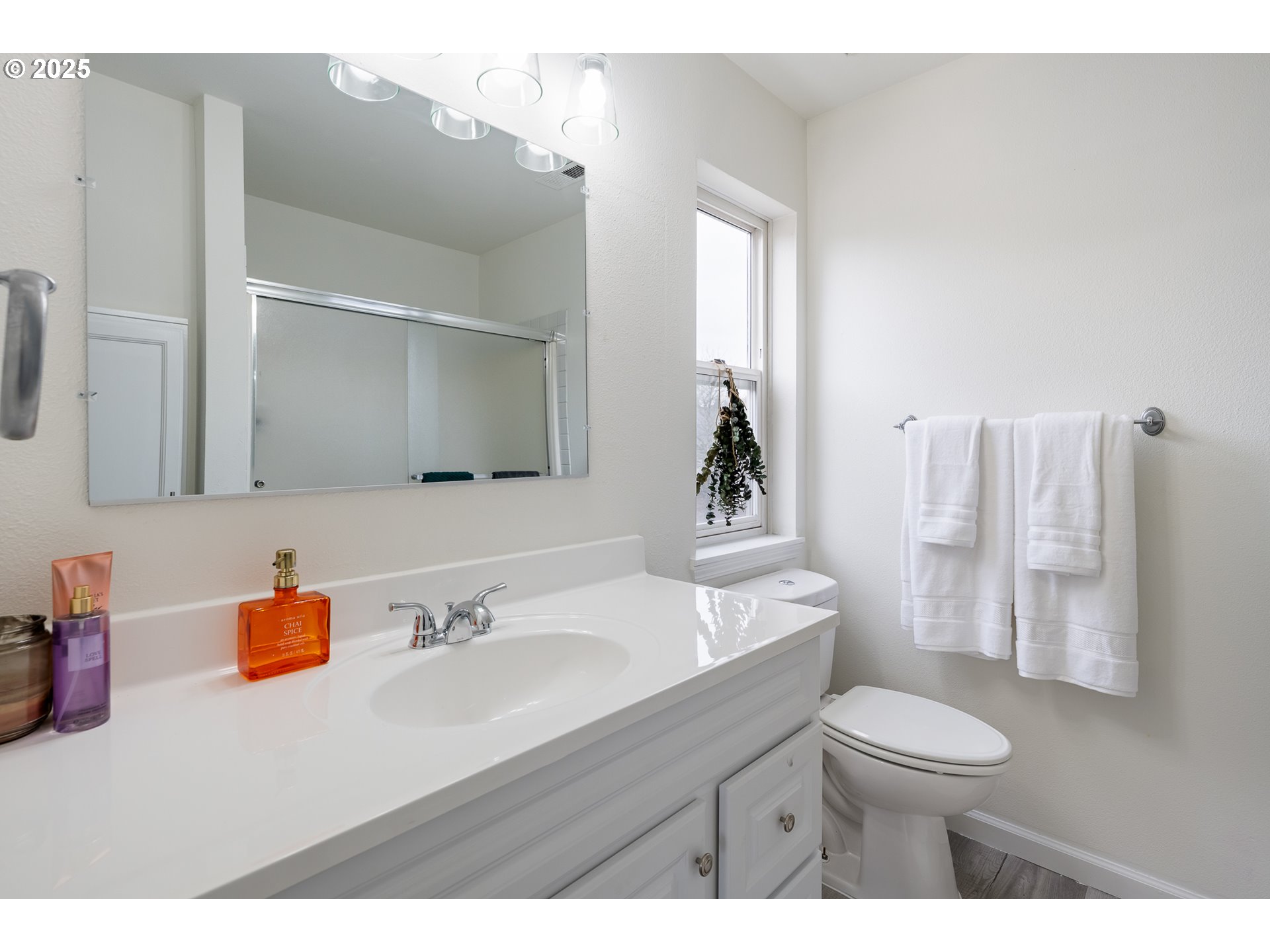 16033 Northwest Ridgetop Lane Beaverton, OR 97006 - Photo 15 of 42 a bathroom with a sink toilet a mirror and shower