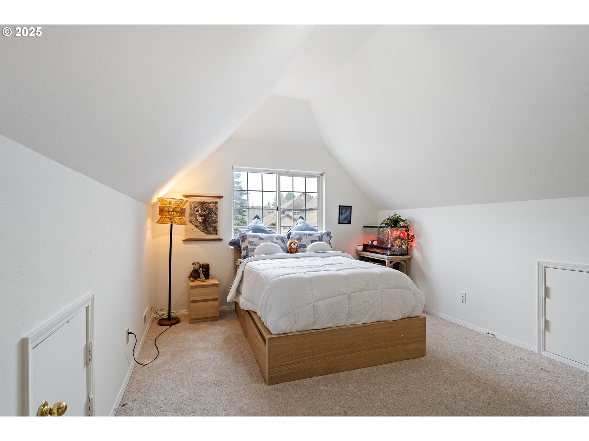 16033 Northwest Ridgetop Lane Beaverton, OR 97006 - Photo 19 of 42 a bedroom with a bed and a window