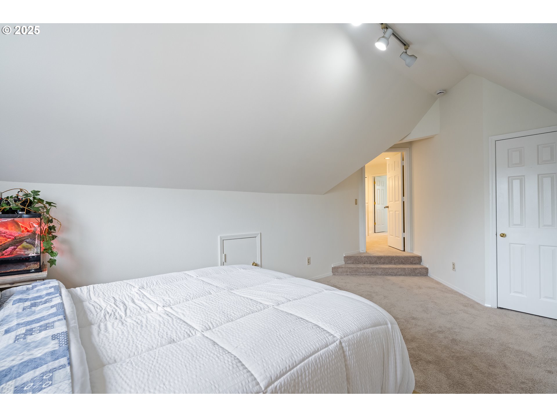 16033 Northwest Ridgetop Lane Beaverton, OR 97006 - Photo 21 of 42 a bedroom with a bed and a window