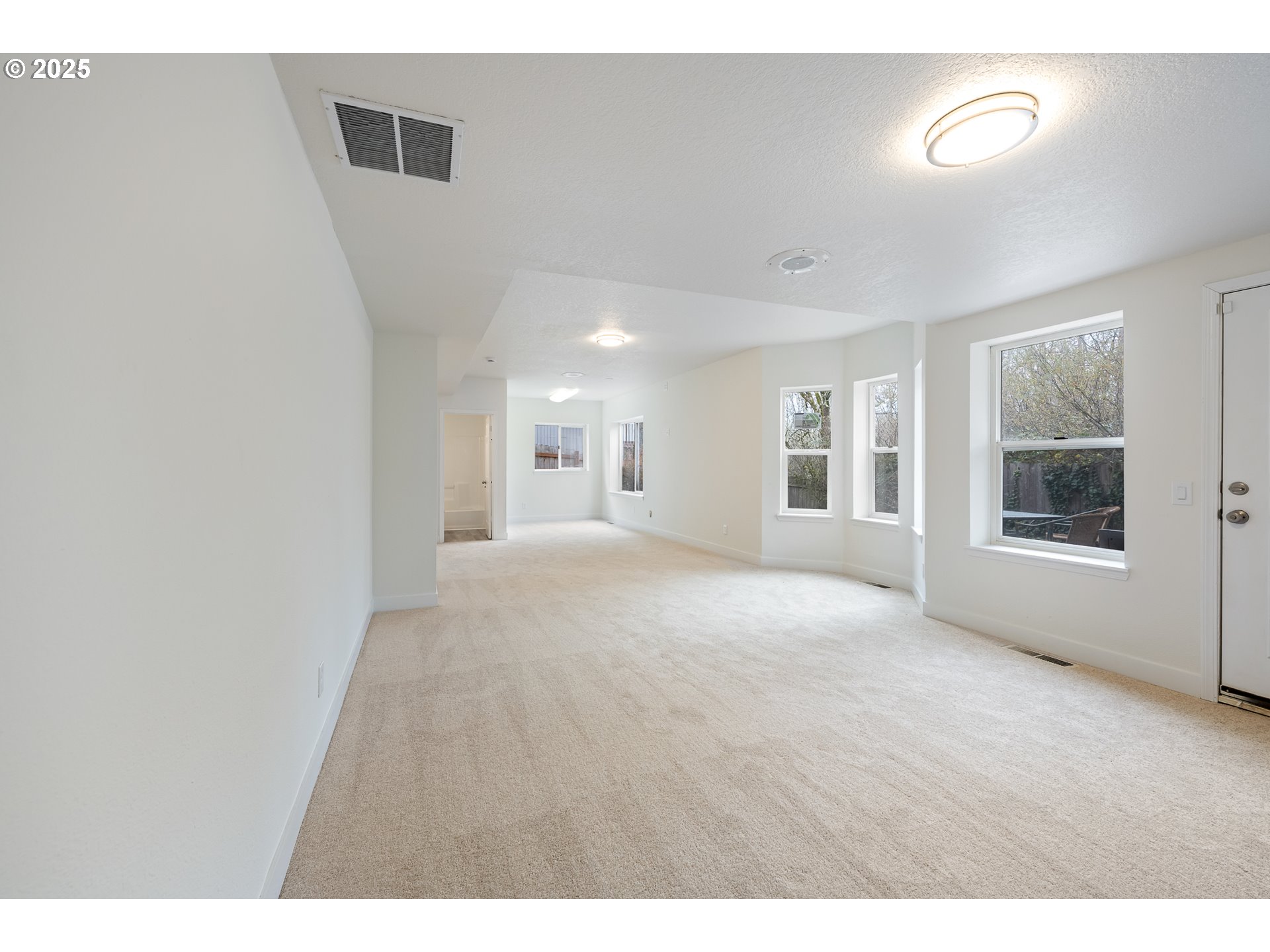 16033 Northwest Ridgetop Lane Beaverton, OR 97006 - Photo 33 of 42 a view of an empty room with a window
