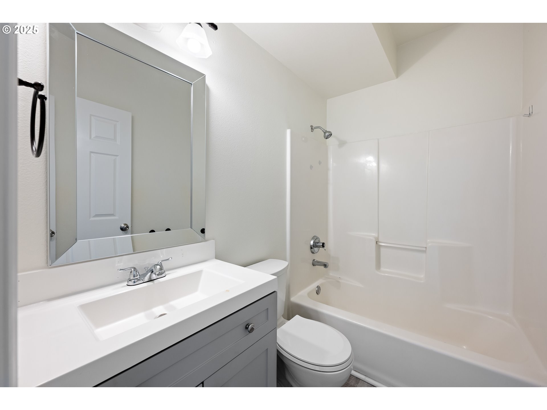 16033 Northwest Ridgetop Lane Beaverton, OR 97006 - Photo 34 of 42 a bathroom with a sink double vanity granite tub shower and a mirror