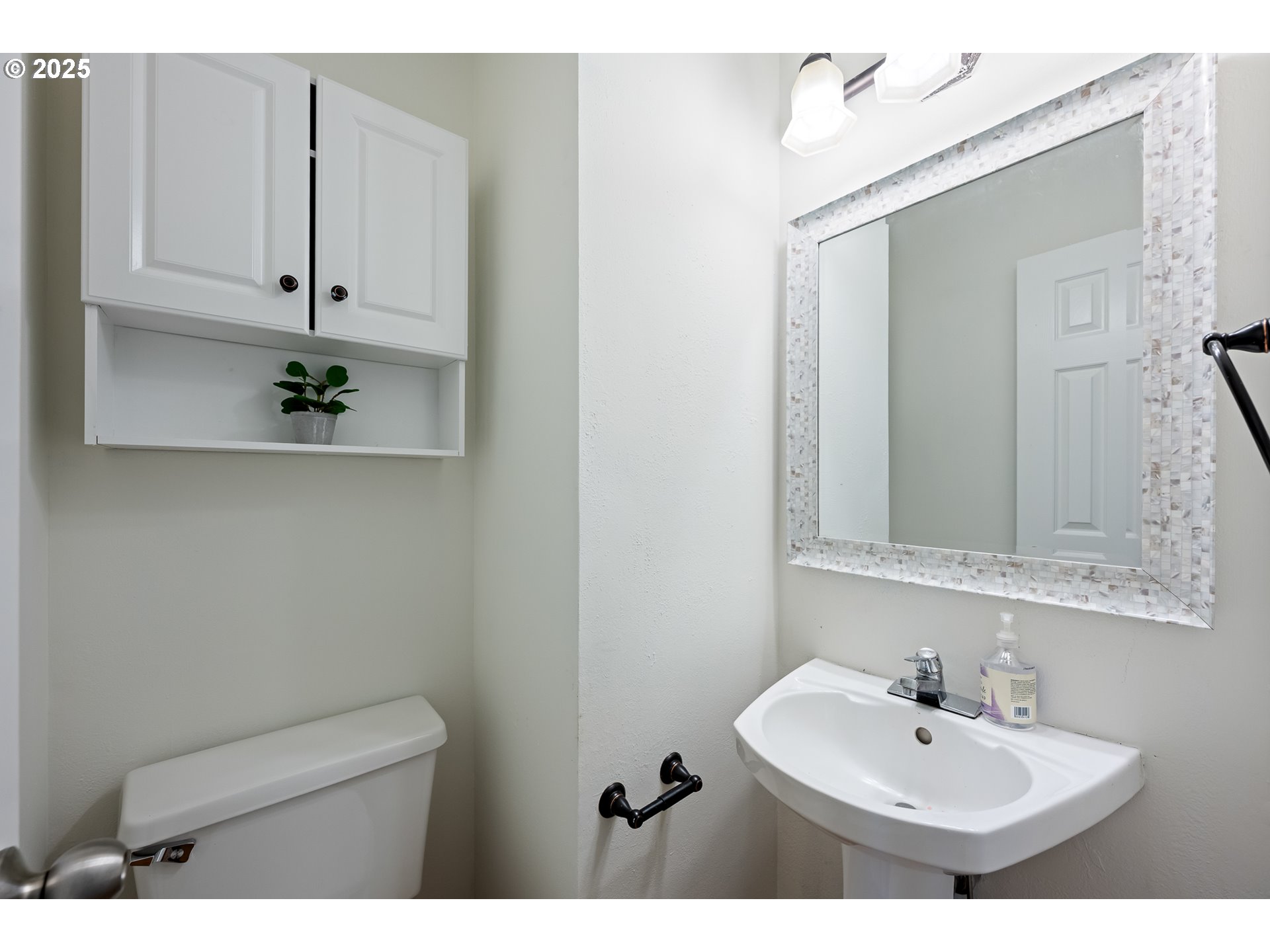 16033 Northwest Ridgetop Lane Beaverton, OR 97006 - Photo 35 of 42 a bathroom with a sink a toilet and mirror