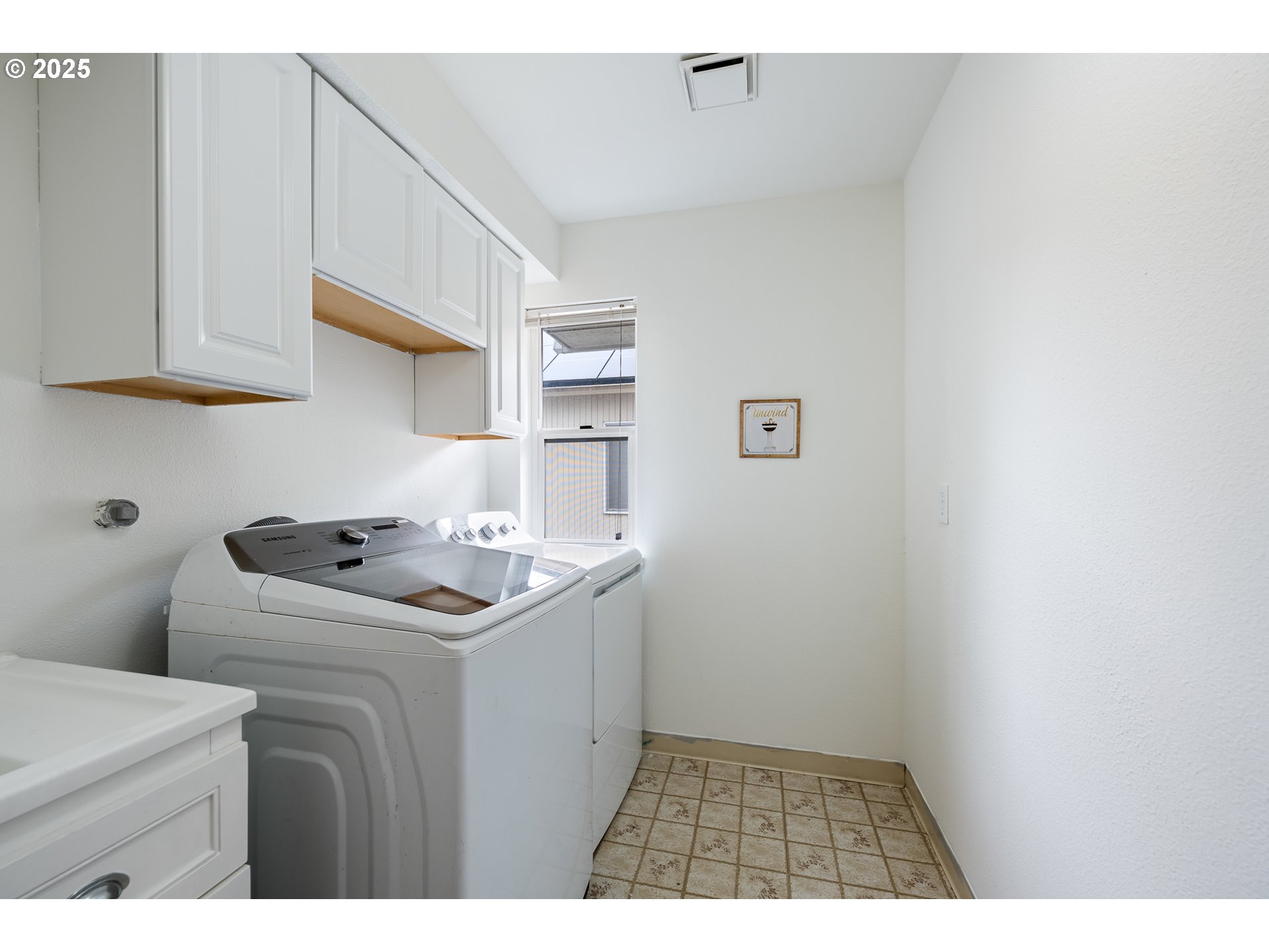16033 Northwest Ridgetop Lane Beaverton, OR 97006 - Photo 36 of 42 a utility room with sink dryer and washer