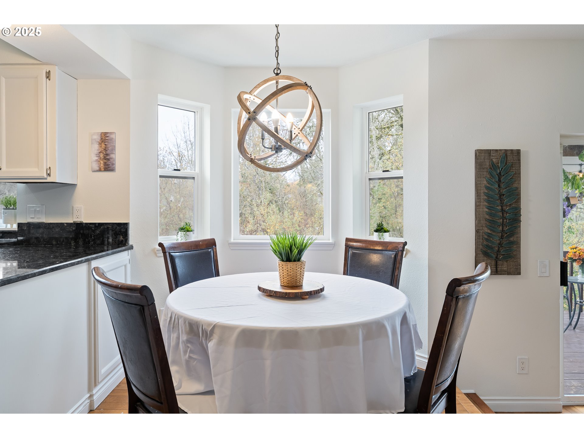 16033 Northwest Ridgetop Lane Beaverton, OR 97006 - Photo 9 of 42 a kitchen with a table and a chair