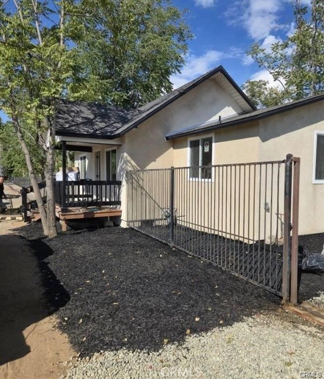 434 Highland Avenue Riverside, CA 92507 - Photo 11 of 15 a view of a house with a small yard and wooden fence