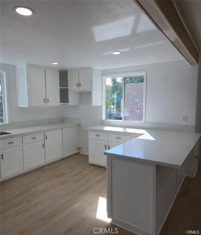 434 Highland Avenue Riverside, CA 92507 - Photo 8 of 15 a kitchen with a sink cabinets and window