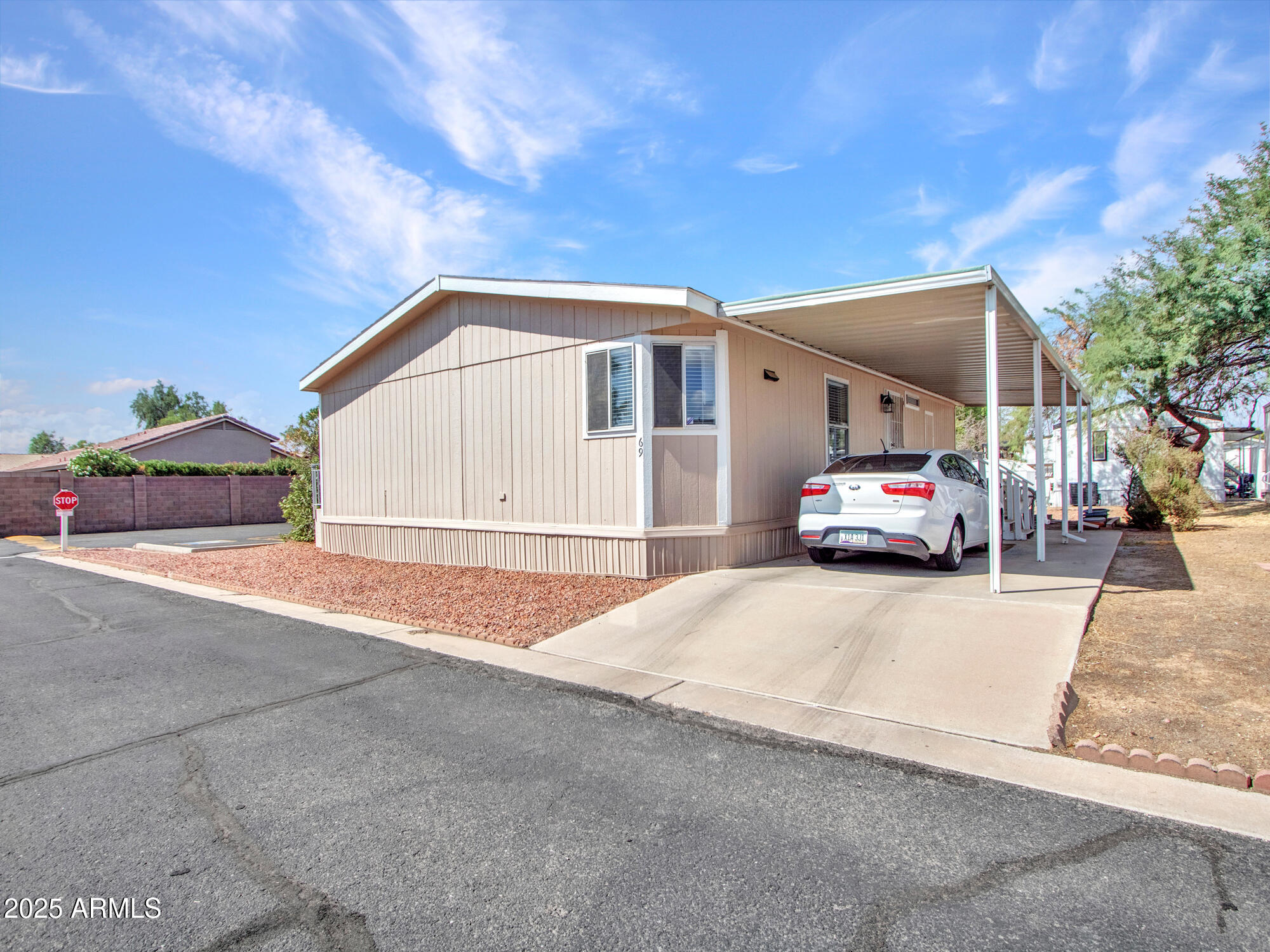 6227 North Litchfield Road, Unit 69 Litchfield Park, AZ 85340 - Photo 1 of 30 a car parked in front of house