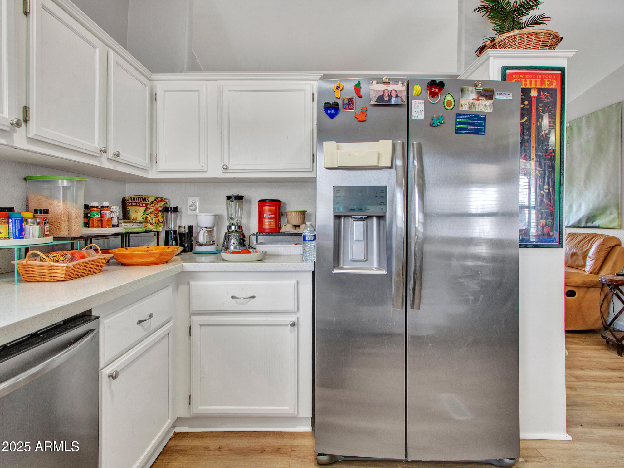 6227 North Litchfield Road, Unit 69 Litchfield Park, AZ 85340 - Photo 14 of 30 a kitchen with refrigerator and cabinets