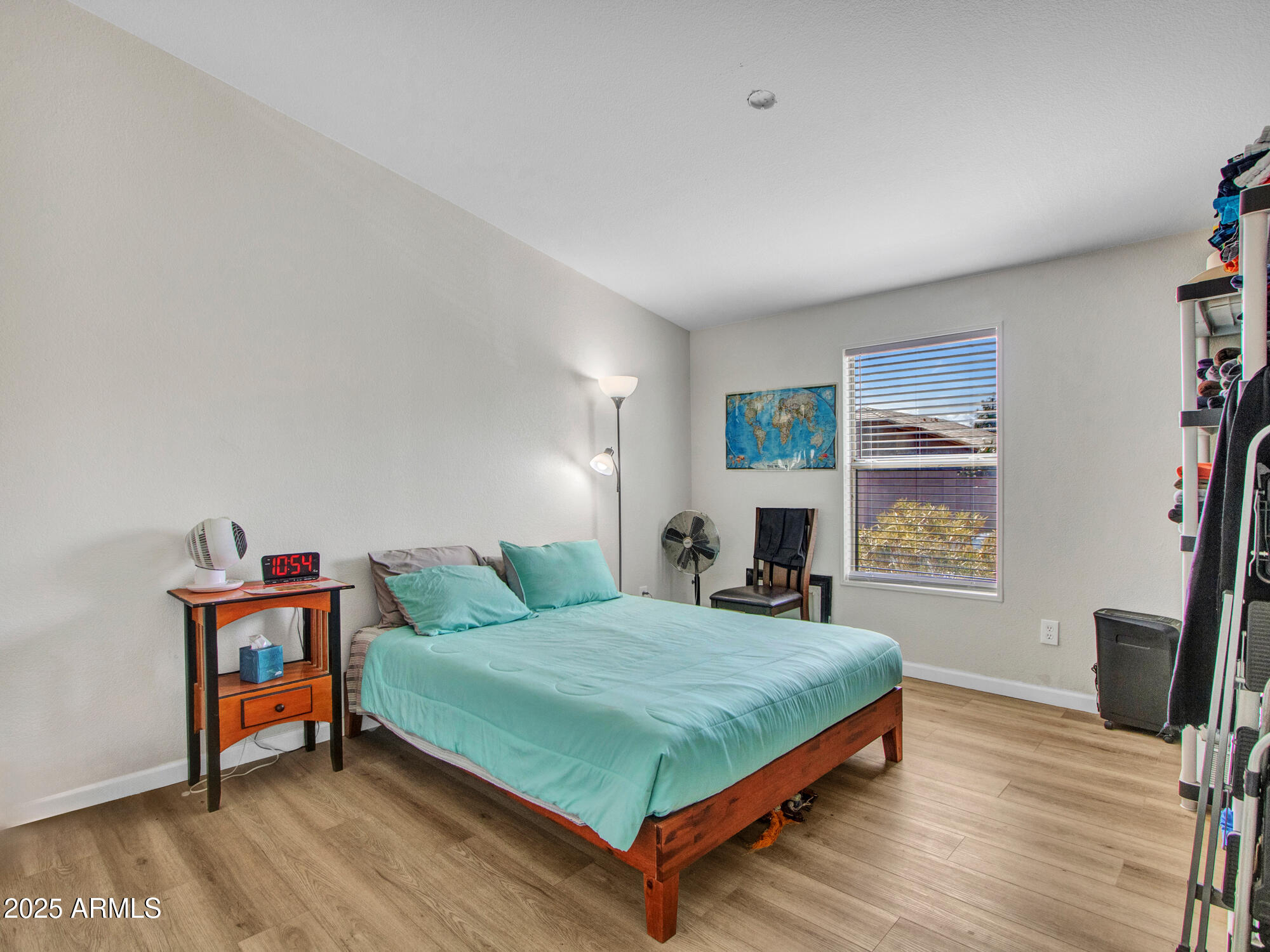 6227 North Litchfield Road, Unit 69 Litchfield Park, AZ 85340 - Photo 18 of 30 a bedroom with a bed table and a window