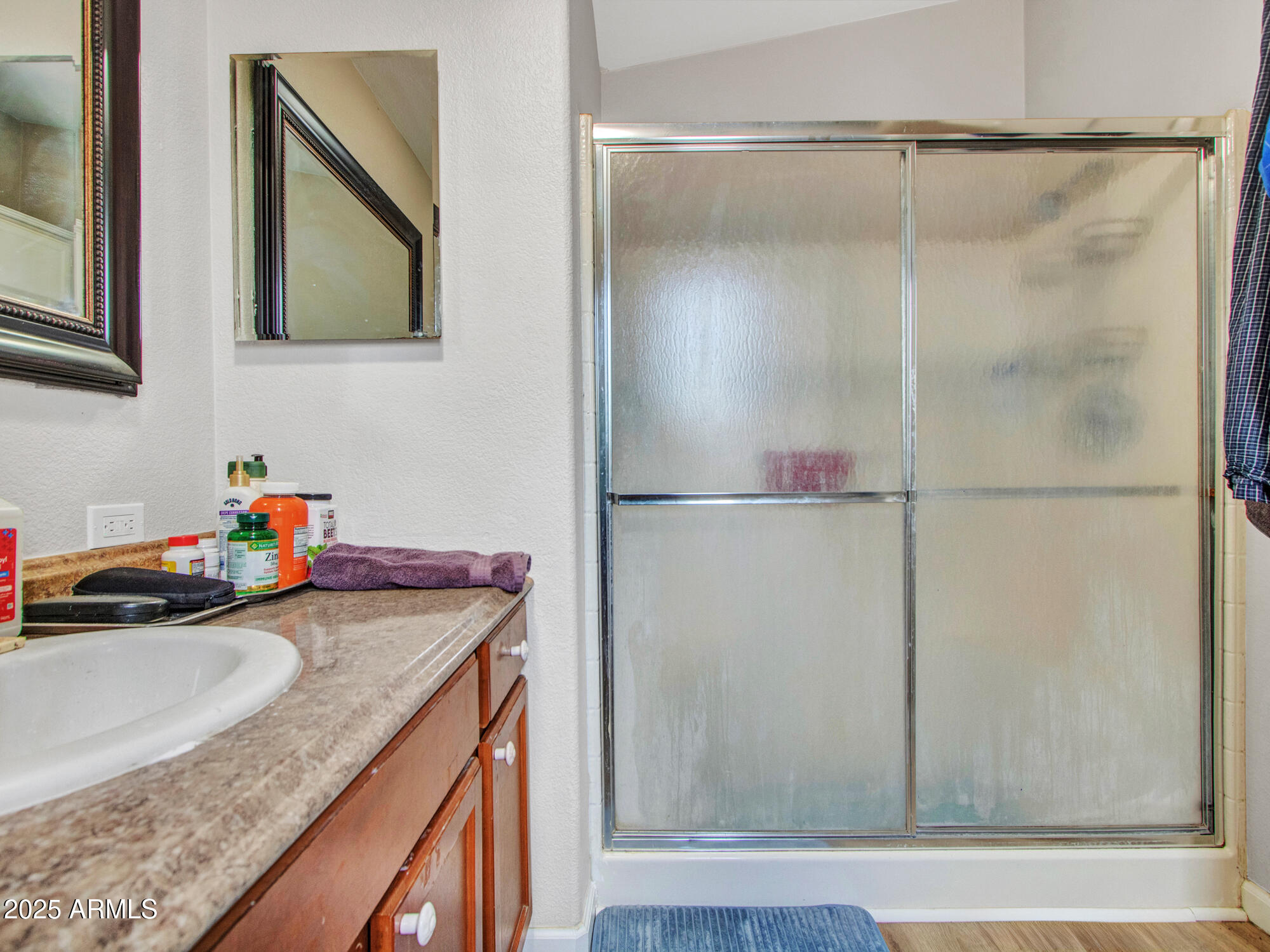 6227 North Litchfield Road, Unit 69 Litchfield Park, AZ 85340 - Photo 25 of 30 a kitchen with a granite countertop sink and cabinets