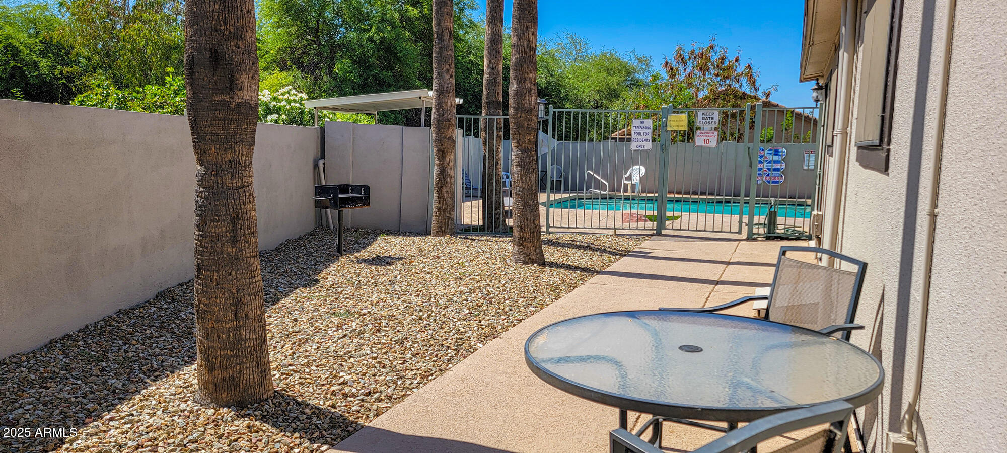 6227 North Litchfield Road, Unit 69 Litchfield Park, AZ 85340 - Photo 27 of 30 a view of a chairs and table in patio