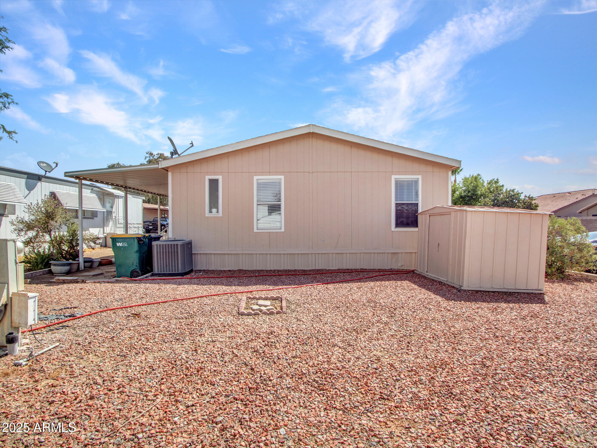 6227 North Litchfield Road, Unit 69 Litchfield Park, AZ 85340 - Photo 5 of 30 a backyard of a house with lots of green space