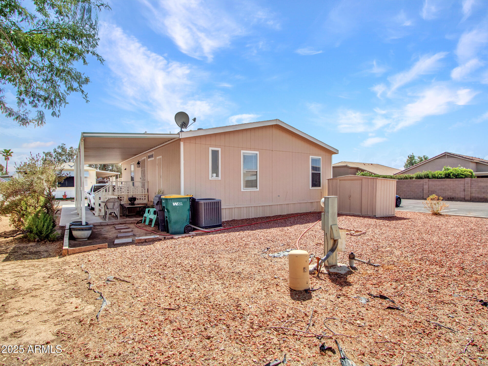 6227 North Litchfield Road, Unit 69 Litchfield Park, AZ 85340 - Photo 6 of 30 a view of a house with backyard and sitting area