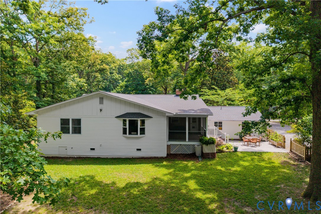 3136 Old Quarry Road Richmond, VA 23225 - Photo 20 of 39 White siding exterior with a bay window and a scre
