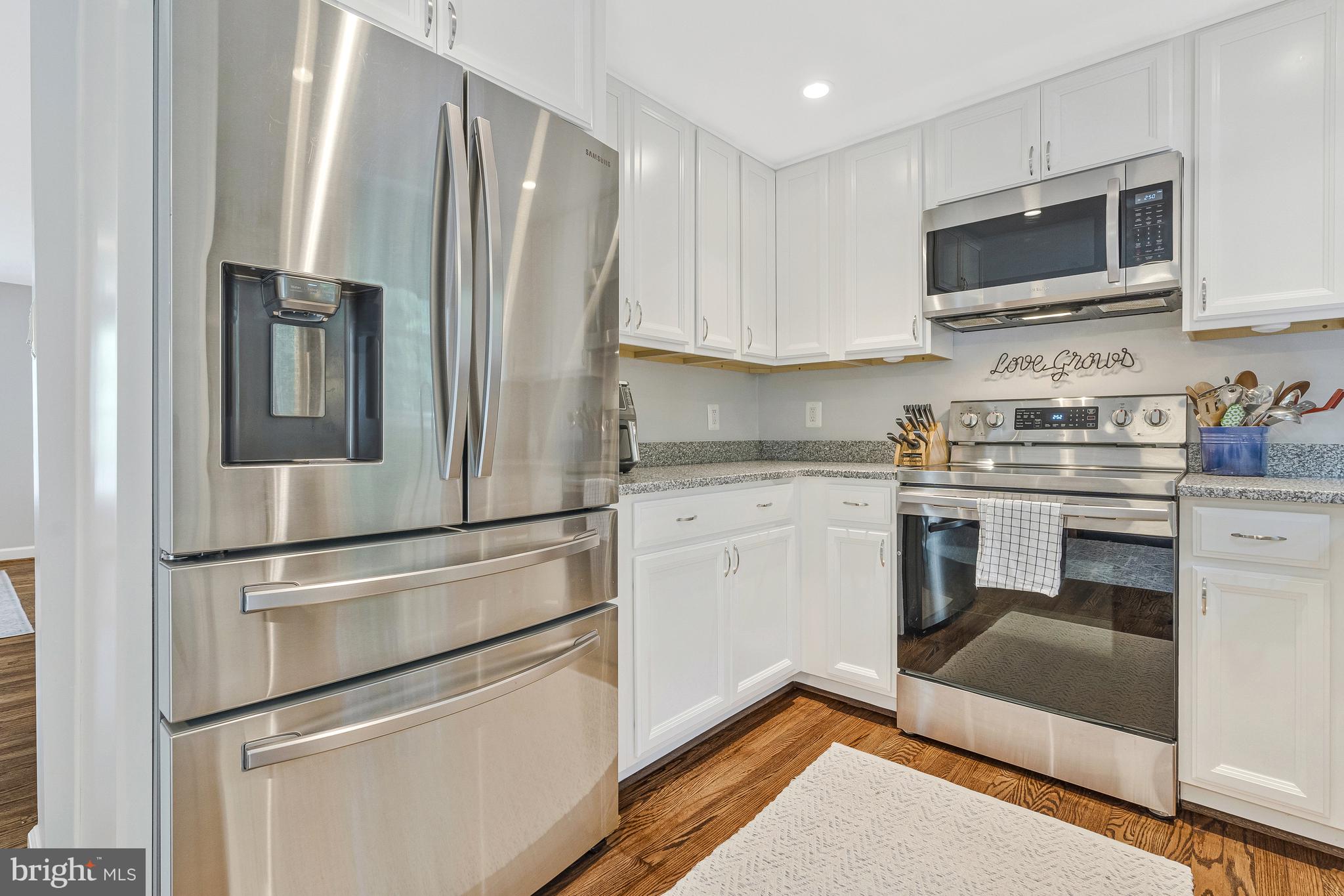 11046 Granby Court Reston, VA 20191 - Photo 5 of 43 a kitchen with a refrigerator stove and microwave