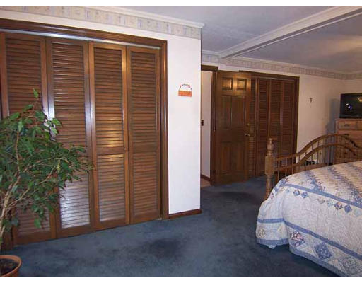 49 Dutchess Street Springfield, MA 01129 - Photo 14 of 25 a bedroom with furniture and a potted plant