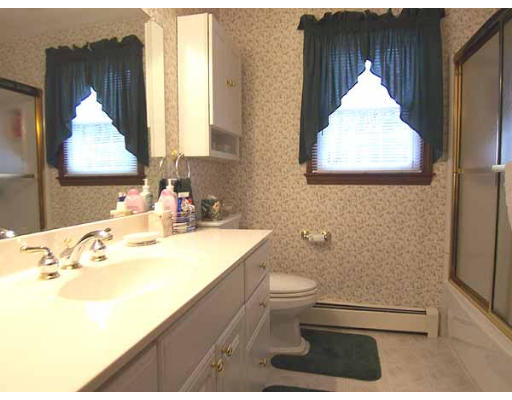 49 Dutchess Street Springfield, MA 01129 - Photo 15 of 25 a bathroom with a sink toilet and mirror