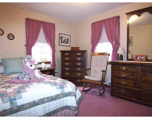 49 Dutchess Street Springfield, MA 01129 - Photo 17 of 25 a bedroom with a bed and a window