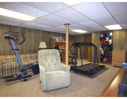 49 Dutchess Street Springfield, MA 01129 - Photo 18 of 25 a living room with furniture gym equipment and a table