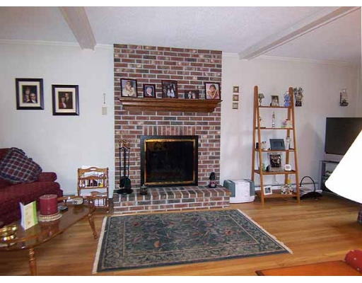 49 Dutchess Street Springfield, MA 01129 - Photo 7 of 25 a living room with furniture and a fireplace