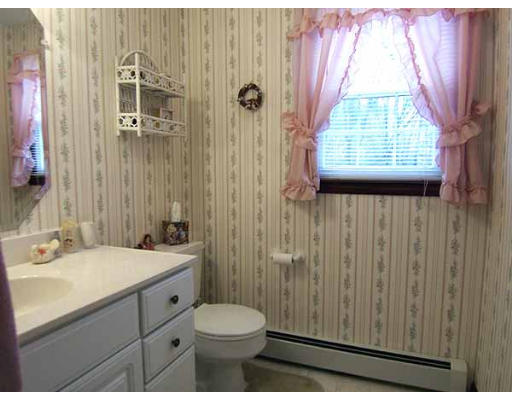 49 Dutchess Street Springfield, MA 01129 - Photo 9 of 25 a bathroom with a sink a toilet and shower