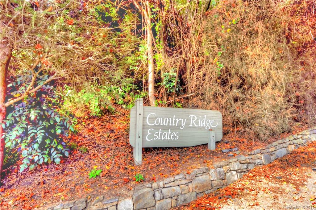 9999 Country Ridge Road Hendersonville, NC 28739 - Photo 12 of 15 a sign that is sitting on a brick wall