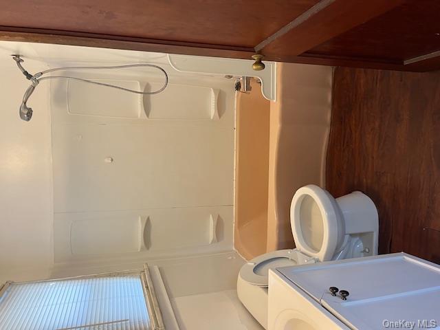 177 South Plank Road, Unit #2 Newburgh, NY 12550 - Photo 3 of 6 Full bathroom featuring toilet, vanity, wood-type flooring, and washtub / shower combination