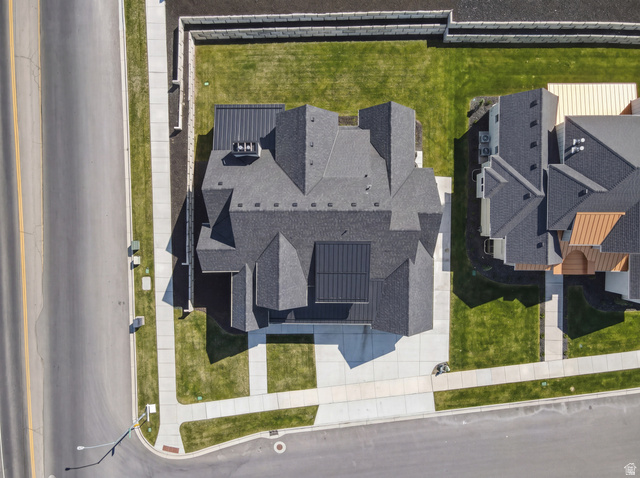 1682 North 1950 W Street, Unit 9 Provo, UT 84604 - Photo 8 of 84 Modern residential property featuring a multi-gabled dark shingle roof with integrated solar panels and a contrasting dark metal roof section