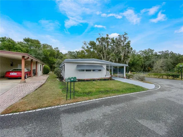 a view of a house with a big yard