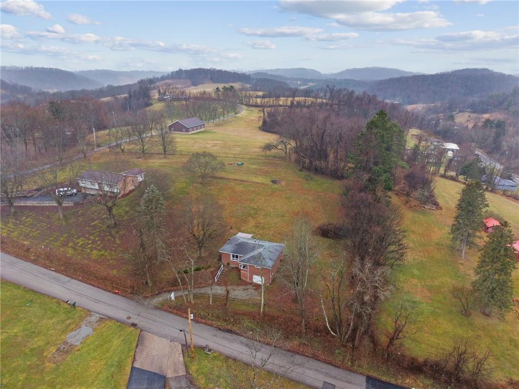 116 Grange Road Greensburg, PA 15601 - Photo 26 of 29 a view of a lake with a mountain in the background