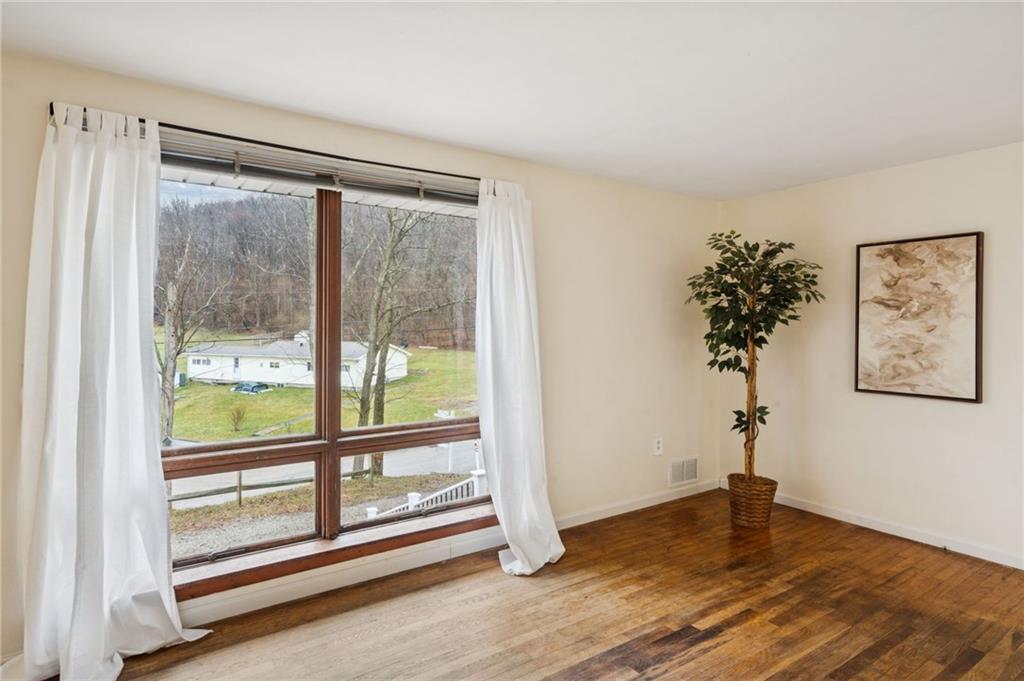 116 Grange Road Greensburg, PA 15601 - Photo 4 of 29 a view of a room with wooden floor and window