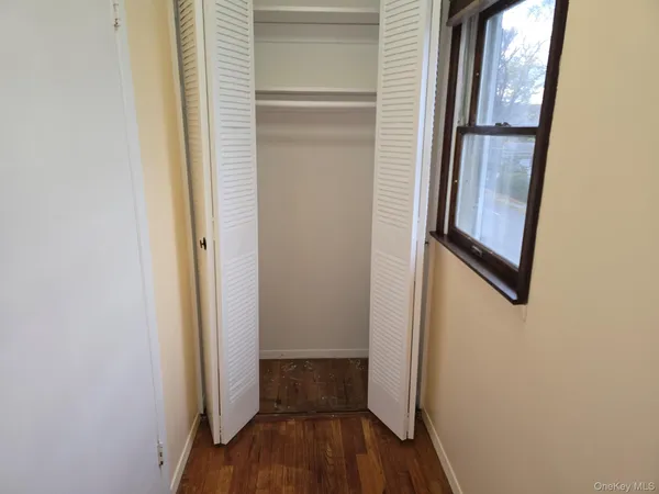 a view of front door with wooden floor