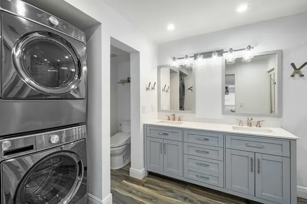 a view of a hallway with washer and dryer