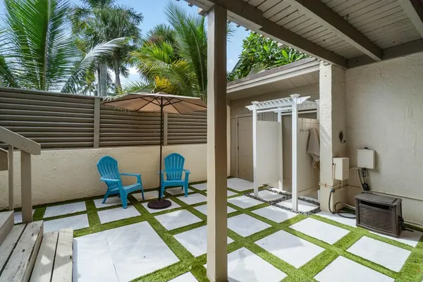 a view of balcony with wooden floor and outdoor seating