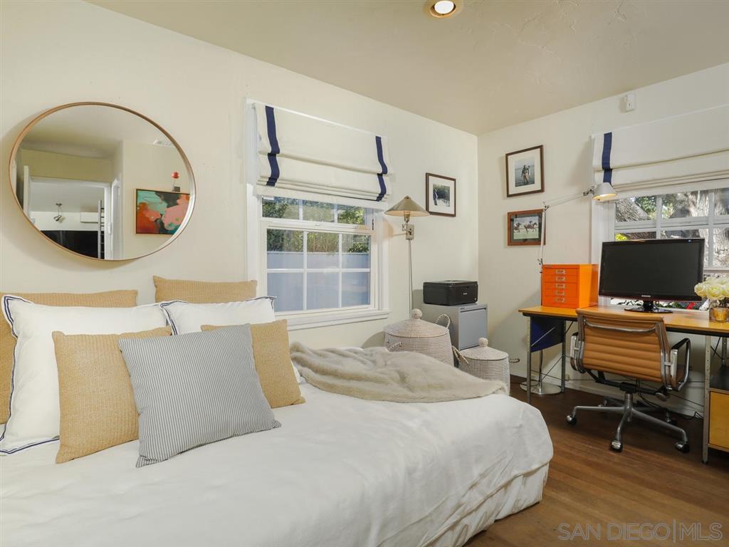253 26th Street Del Mar, CA 92014 - Photo 14 of 22 a bedroom with a large bed and a flat screen tv