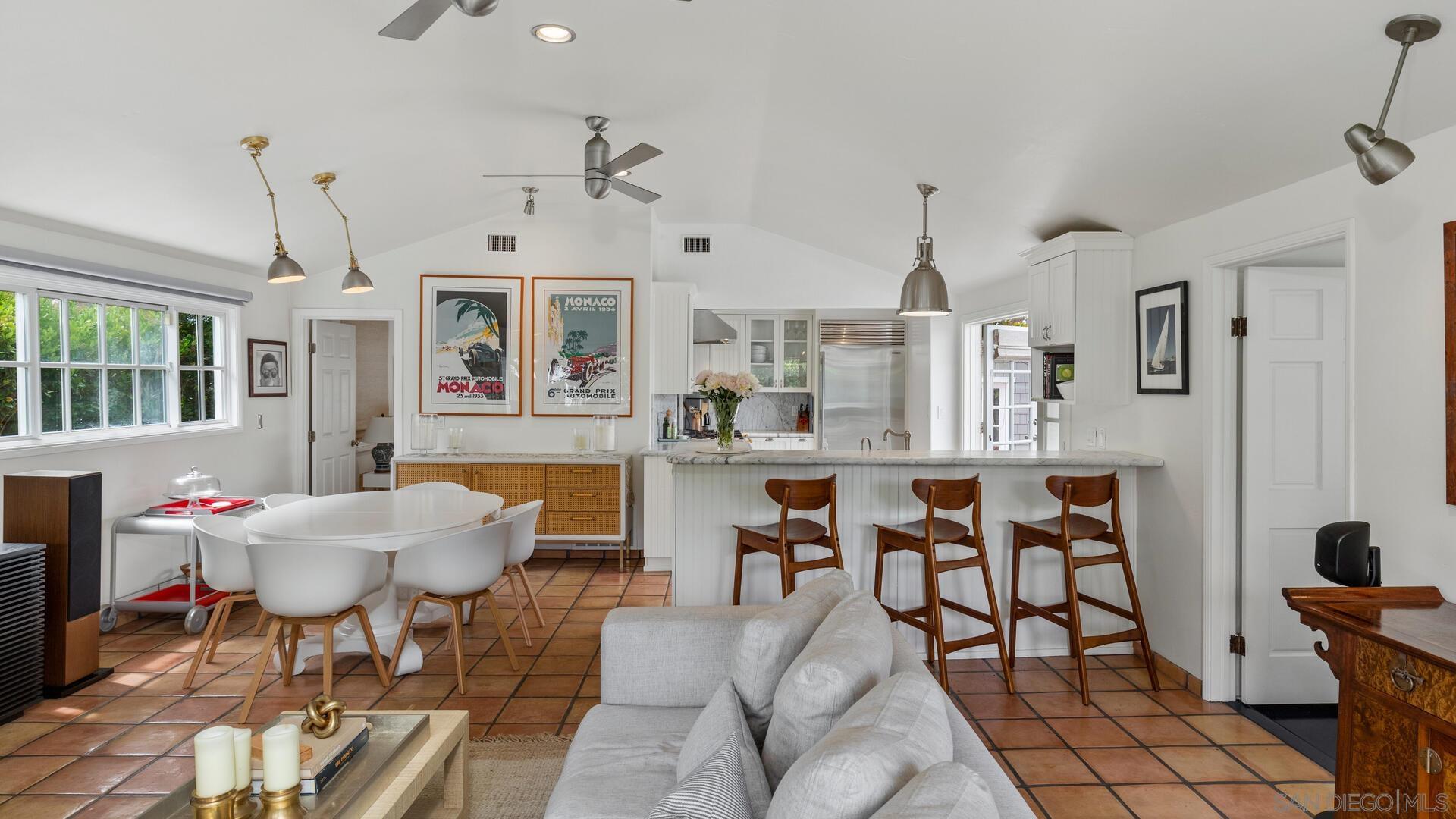 253 26th Street Del Mar, CA 92014 - Photo 6 of 22 a living room with furniture a dining table and a chandelier