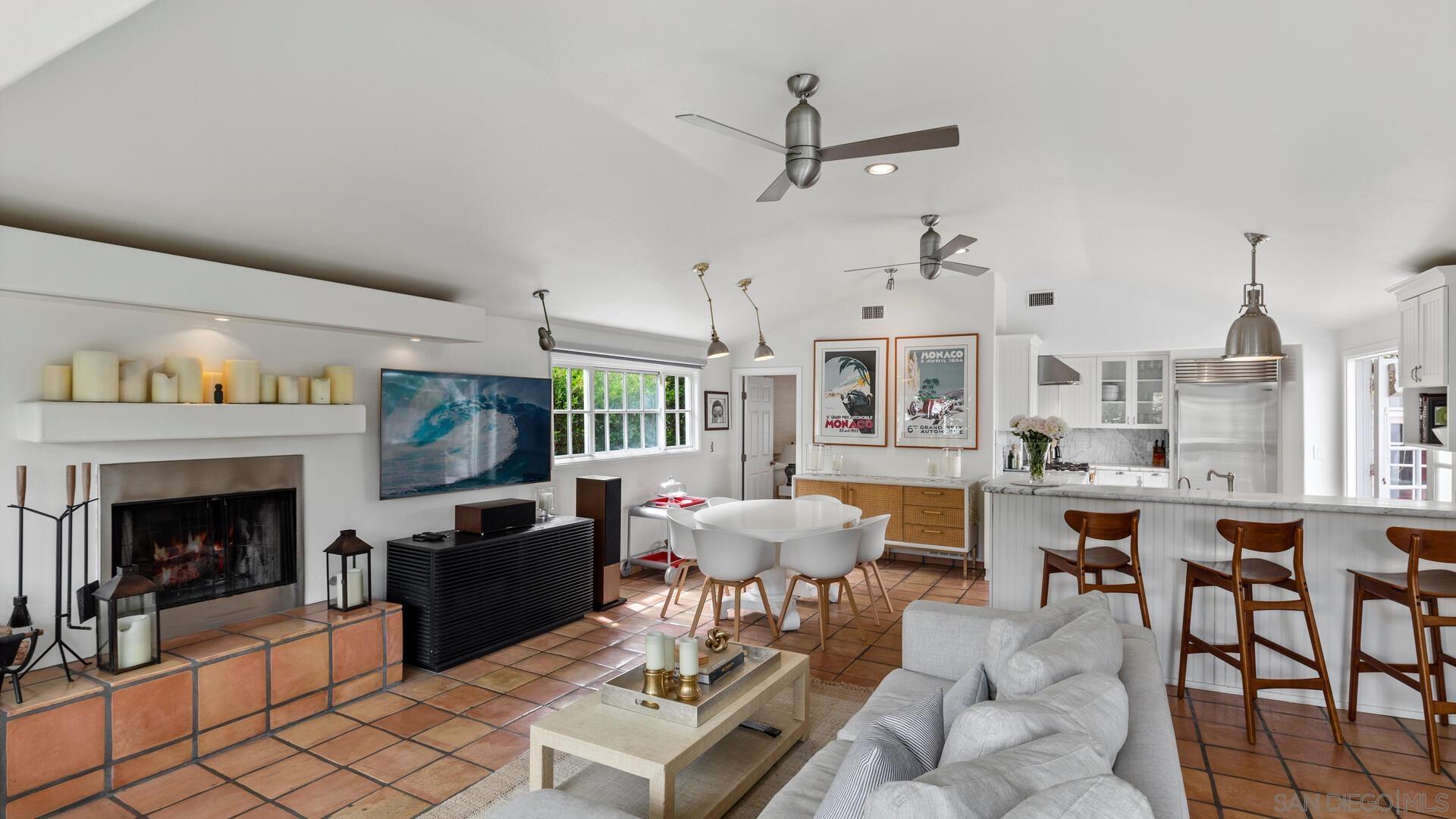 253 26th Street Del Mar, CA 92014 - Photo 9 of 22 a living room with furniture a fireplace and a chandelier