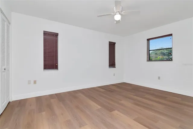 a bedroom with a large bed and a couch