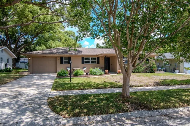 a front view of a house with a yard and porch