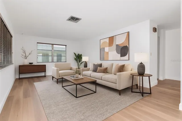 a view of a kitchen with a sink and a refrigerator