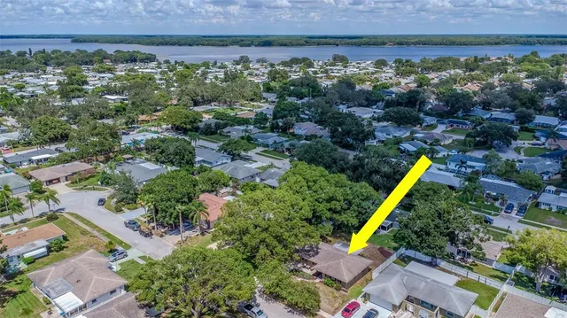 an aerial view of a house with a yard