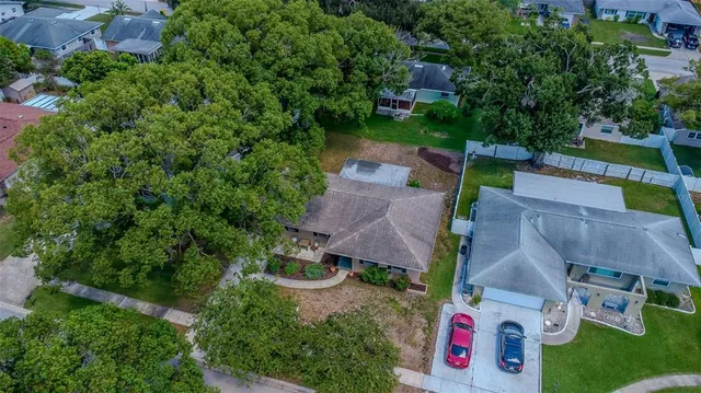 an aerial view of a house with a swimming pool