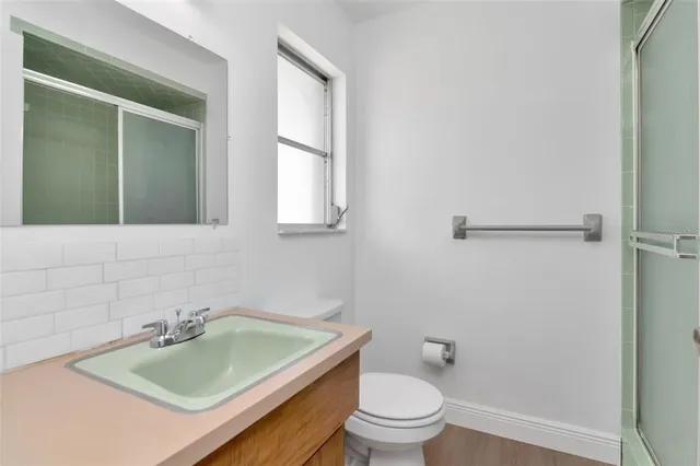 a bathroom with a sink a toilet and a bathtub