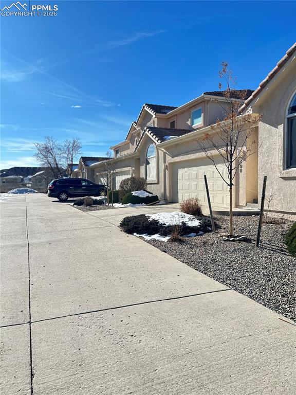 198 Luxury Lane Colorado Springs, CO 80921 - Photo 2 of 34 a view of a house with a snow in the yard