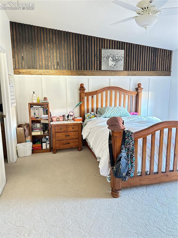 198 Luxury Lane Colorado Springs, CO 80921 - Photo 26 of 34 a bedroom with furniture and a window