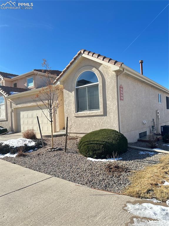198 Luxury Lane Colorado Springs, CO 80921 - Photo 3 of 34 a front view of a house with a yard