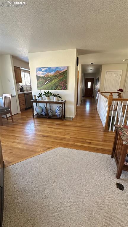 198 Luxury Lane Colorado Springs, CO 80921 - Photo 32 of 34 a living room with furniture and a flat screen tv